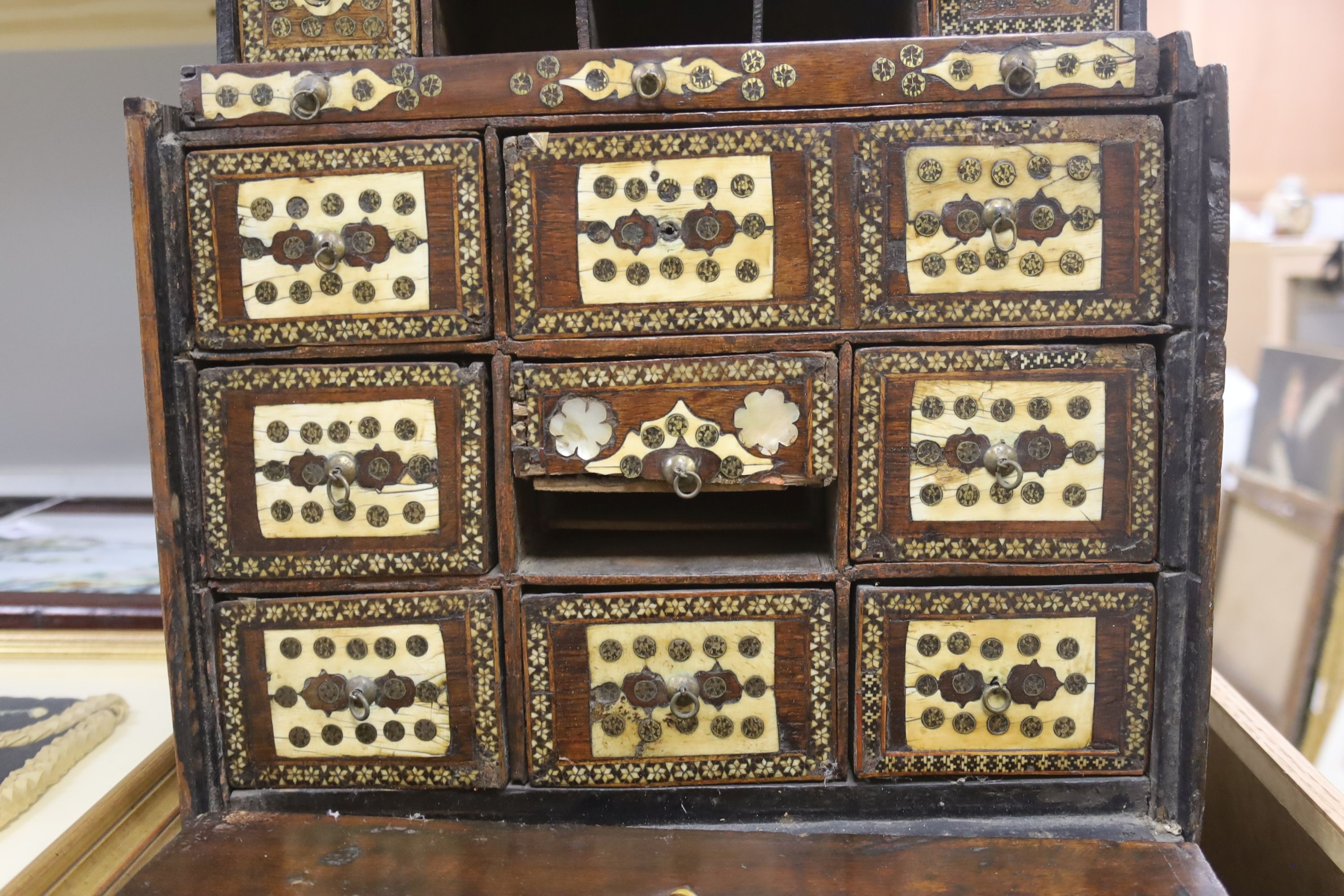 A 17th century Hispano Moresque bone inlaid walnut table cabinet 40cm